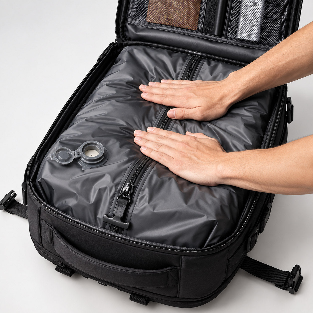 Hands pressing the liner flat inside the bag