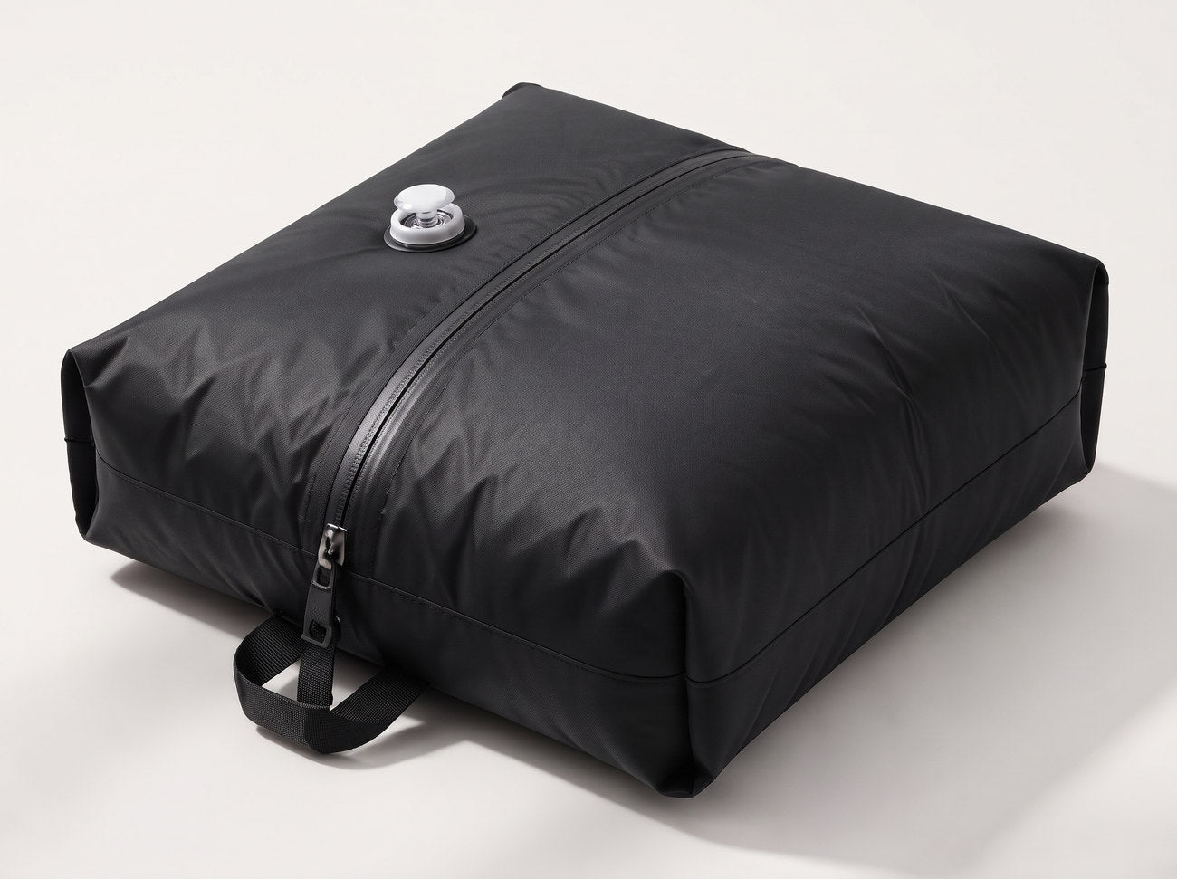 The compression sack packed and full of air